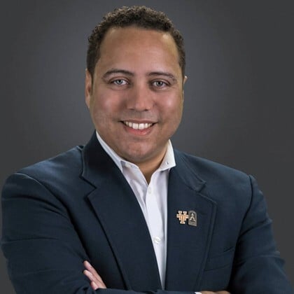 Portrait of a scientist looking intensely at laboratory equipment
